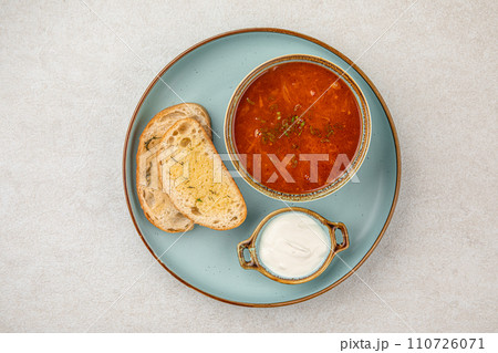 Portion of slavic traditional red soup borscht 110726071