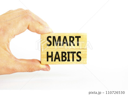 Smart habits symbol. Concept words Smart habits on wooden blocks. Beautiful white table white background. Businessman hand. Business and smart habits concept. Copy space. Smart habits symbol. Concept words Smart habits on wooden blocks. Beautiful white table white background. Businessman hand. Business and smart habits concept. Copy space. 110726530