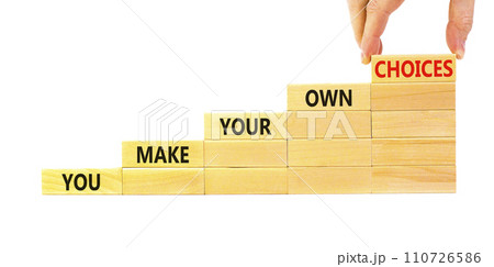 You make your own choice symbol. Concept words You make your own choice on wood blocks. Beautiful white table white background. Businessman hand. Business you make your own choice concept. Copy space. 110726586