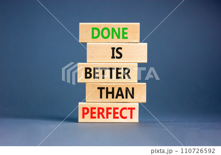 Done is better than perfect symbol. Concept words Done is better than perfect on wooden blocks. Beautiful grey table grey background. Business, done is better than perfect concept. Copy space. 110726592