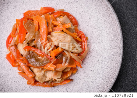 Delicious fresh stew with chicken or turkey with slices of sweet pepper and carrots 110729921