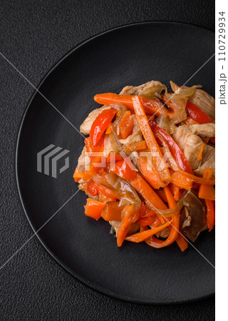 Delicious fresh stew with chicken or turkey with slices of sweet pepper and carrots 110729934