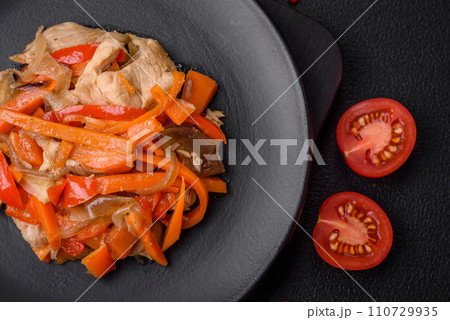 Delicious fresh stew with chicken or turkey with slices of sweet pepper and carrots 110729935