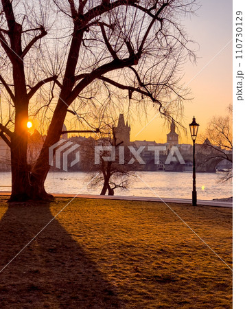 Prague bridge over a river with a city in the background Prague bridge over a river with a city in the background 110730129