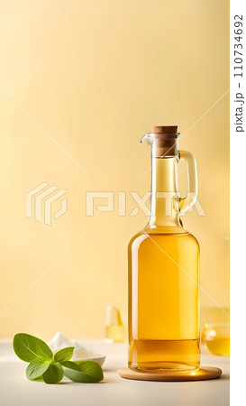 olive oil and leaves of olive oil with copy space background olive oil and leaves of olive oil with copy space background 110734692