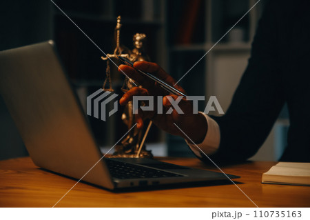 Judge gavel with Justice lawyers having team meeting at law firm background. Concepts of Law and Legal services. 110735163