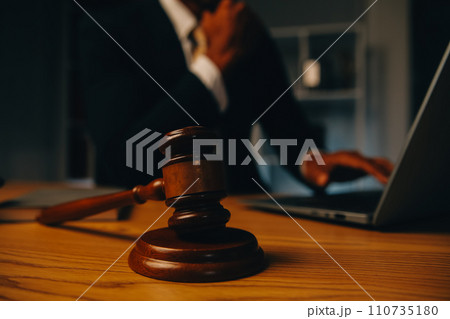 Judge gavel with Justice lawyers having team meeting at law firm background. Concepts of Law and Legal services. Judge gavel with Justice lawyers having team meeting at law firm background. Concepts of Law and Legal services. 110735180