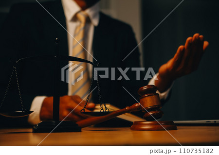 Judge gavel with Justice lawyers having team meeting at law firm background. Concepts of Law and Legal services. 110735182