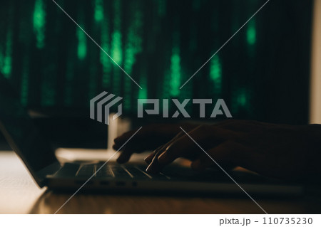 Hacker code in laptop. Cyber security, privacy or hack threat. Coder or programmer writing virus software, malware, internet attack or developing digital design. Green web data in computer screen. 110735230