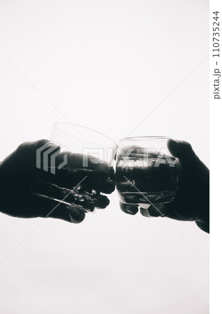 Whiskey splashing out of glass, isolated on white background Whiskey splashing out of glass, isolated on white background 110735244