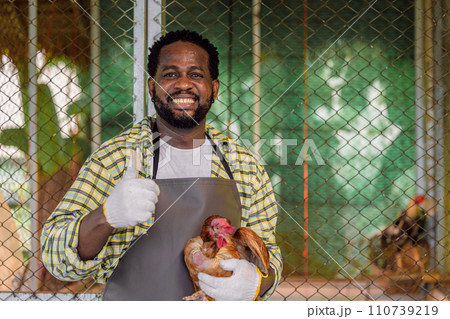 african male farmer worker standing portrait in livestock farm small business owner happy smile 110739219