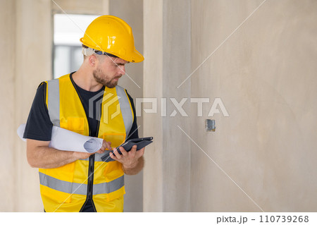 Engineer worker builder contractor work in construction site for building inspector QC job checking detail project progress 110739268