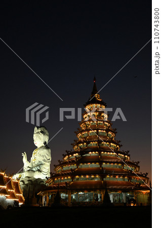 Scene of night time of Buddhist pagoda and Guan Yin Bodhisattva Statue the largest in Thailand at Wat Hua Pla Kang temple. Located at Chiang Rai Province in Thailand. Scene of night time of Buddhist pagoda and Guan Yin Bodhisattva Statue the largest in Thailand at Wat Hua Pla Kang temple. Located at Chiang Rai Province in Thailand. 110743800