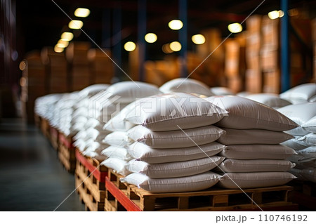 White bag rice or grits storage barn, Close-up of a warehouse with bulk rice or sugar bags in a distribution center, bulk rice procurement, production and transportation of rice, AI White bag rice or grits storage barn, Close-up of a warehouse with bulk rice or sugar bags in a distribution center, bulk rice procurement, production and transportation of rice, AI 110746192