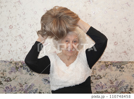Senior woman with a wig hair, beauty details, hair concept Senior woman with a wig hair, beauty details, hair concept 110748458