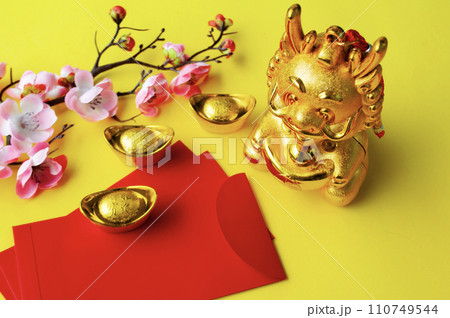 Top view of Chinese New Year red packet and golden ingot. Chinese New Year celebration concept 110749544