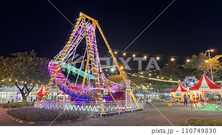 illuminated pirate ship swing boat ride in the amusement recreation park, Christmas market illuminated pirate ship swing boat ride in the amusement recreation park, Christmas market 110749830