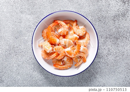 Shrimps on a plate. Healthy food, seafood. Top view Shrimps on a plate. Healthy food, seafood. Top view 110750513