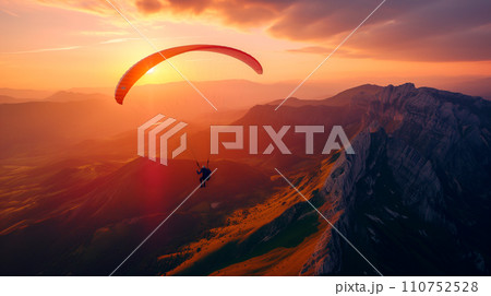 AI-generated content. Paraglider silhouette flying over above green hills and mountains at sunset. Beauty world. Extreme sport.  110752528