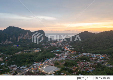Aerial top view of Samet Nangshe, Phang Nga with city town, lush green trees from above in tropical forest in national park in summer season. Natural landscape. Pattern texture background. 110754030