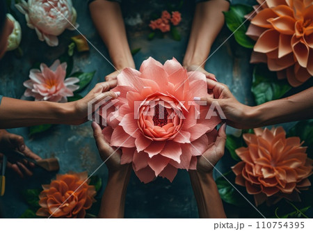 people with paper tools behind a pink flower people with paper tools behind a pink flower 110754395