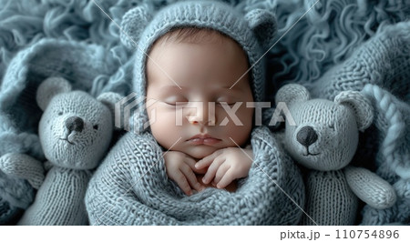 newborn baby boy sleeping in blanket with bears newborn baby boy sleeping in blanket with bears 110754896