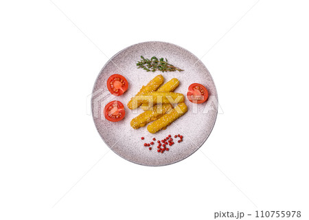 Delicious crispy cheese sticks with mozzarella, salt and spices, breaded and fried in oil 110755978