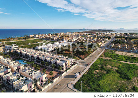 Torre de la Horadada aerial shot, drone point of view of Mediterranean Seascape and townscape view. Travel destinations and holiday concept. Costa Blanca. Spain 110756804