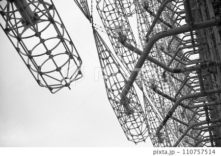 Metal frameworks with extensive wiring under an overcast sky. Duga is a Soviet over-the-horizon radar station for an early detection system for ICBM launches. 110757514