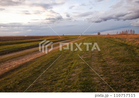 A wide, open space under a stormy sky. A wide, open space under a stormy sky. 110757515