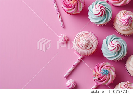 Pink table top on pink background with decorated lollipops and cupcakes, children birthday party Pink table top on pink background with decorated lollipops and cupcakes, children birthday party 110757732