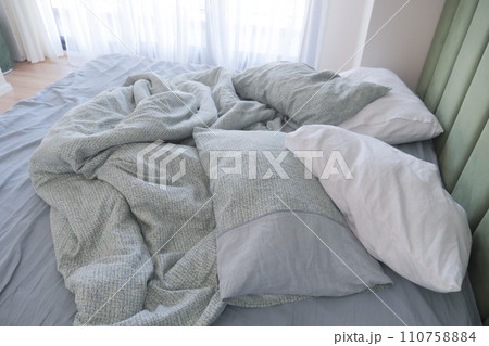 messy bed in early morning , messy bed after waking up messy bed in early morning , messy bed after waking up 110758884