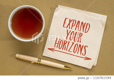 Expand your horizons - inspirational note on a napkin with tea, open mind and personal development concept Expand your horizons - inspirational note on a napkin with tea, open mind and personal development concept 110761594