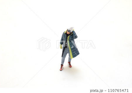 small figurine of an artist with beret on white. small figurine of an artist with beret on white. 110765471