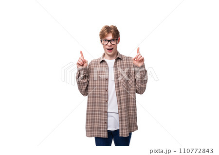 handsome caucasian student guy with glasses tells the news handsome caucasian student guy with glasses tells the news 110772843