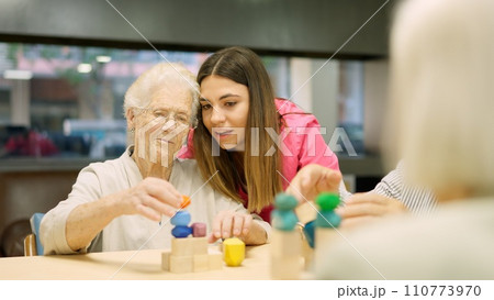 Nurse advising an old woman to resolve a skill game Nurse advising an old woman to resolve a skill game 110773970