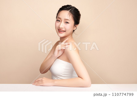 Beautiful young asian woman with clean fresh skin on beige background, Face care, Facial treatment, Cosmetology, beauty and spa, Asian women portrait. 110774799