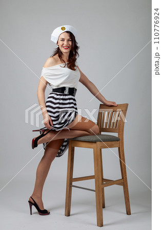 Beautiful woman in sailor costume. 110776924
