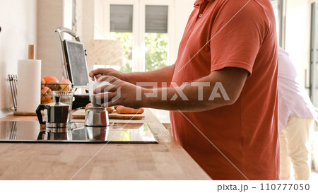 Gay couple preparing coffee and breakfast table at home 110777050
