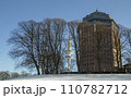 Hamburg in winter, Park around an ancient water tower in Sunny frosty day with a television tower on background. High quality photo 110782712