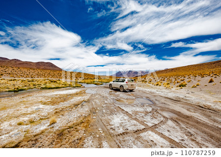 White car in Bolivian desert 110787259