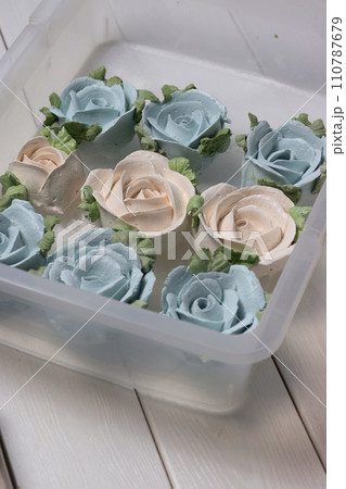 Homemade zephyr spread out on a tray. Flowers from zephyr. Close-up. Homemade zephyr spread out on a tray. Flowers from zephyr. Close-up. 110787679