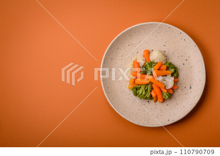 Delicious fresh vegetables broccoli, cauliflower, carrots steamed with salt and spices 110790709