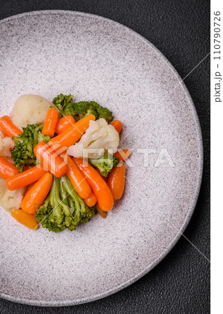Delicious fresh vegetables broccoli, cauliflower, carrots steamed with salt and spices Delicious fresh vegetables broccoli, cauliflower, carrots steamed with salt and spices 110790726
