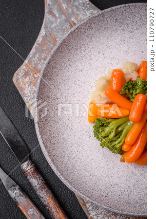 Delicious fresh vegetables broccoli, cauliflower, carrots steamed with salt and spices 110790727