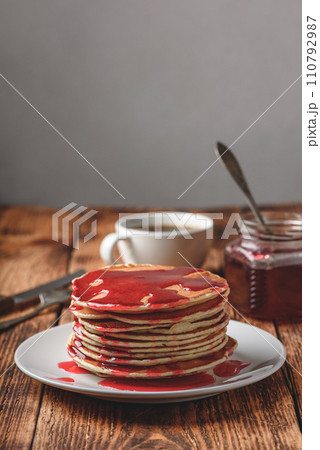 Stack of pancakes with berry jam Stack of pancakes with berry jam 110792987