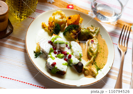 Albanian cornbread with yogurt sauce and baked vegetables Albanian cornbread with yogurt sauce and baked vegetables 110794526