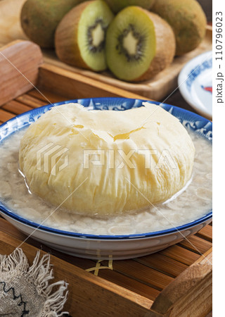Sweet peanut soup with brown sugar bun cake in a bowl  110796023