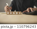 Investment funds and bonds. Plan to invest in bonds and analyze economic data. Little wooden blocks and men are planning 110796243
