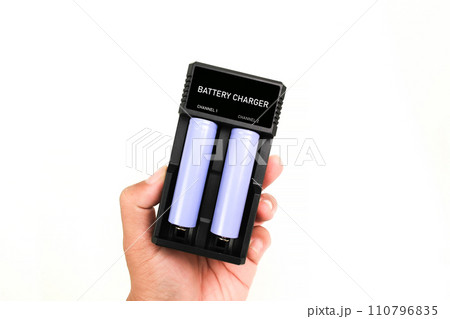 Battery charger isolated in hand on white background , lithium ion battery rechargeableharger Battery charger isolated in hand on white background , lithium ion battery rechargeableharger 110796835